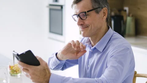 Mid-shot front view of diverse group of coworkers chatting and looking at Stock Footage 278040460