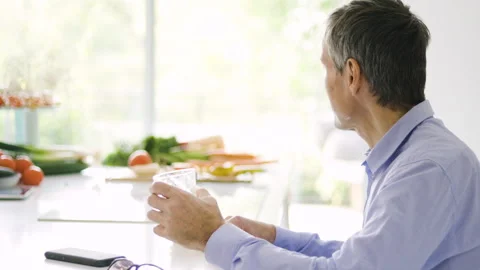Mid-shot front view of diverse group of coworkers chatting and looking at Stock Footage 278040480