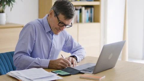 Mid-shot front view of diverse group of coworkers chatting and looking at Stock Footage 278040720