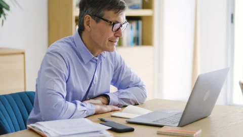 Mid-shot front view of diverse group of coworkers chatting and looking at Stock Footage 278041040