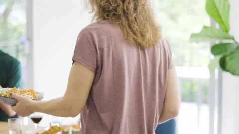 Mid-shot front view of diverse group of coworkers chatting and looking at Stock Footage 278041719