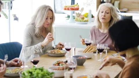 Mid-shot front view of diverse group of coworkers chatting and looking at Stock Footage 278042036