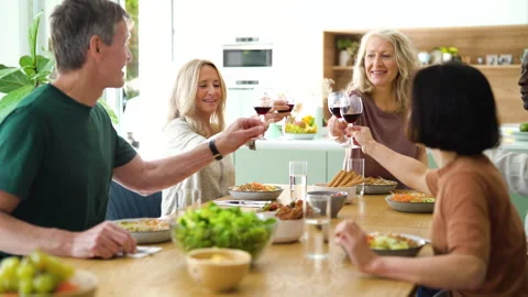 Mid-shot front view of diverse group of coworkers chatting and looking at Stock Footage 278042357