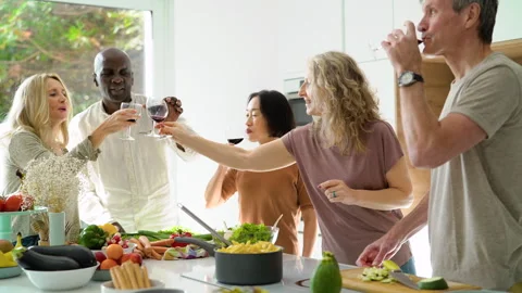 Mid-shot front view of diverse group of coworkers chatting and looking at Stock Footage 278042931