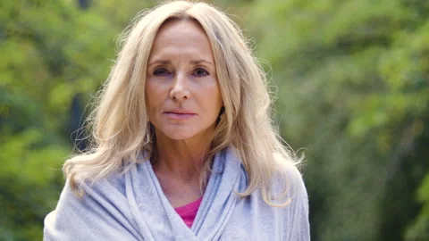 Mid-shot front view of diverse group of coworkers chatting and looking at Stock Footage 278043471