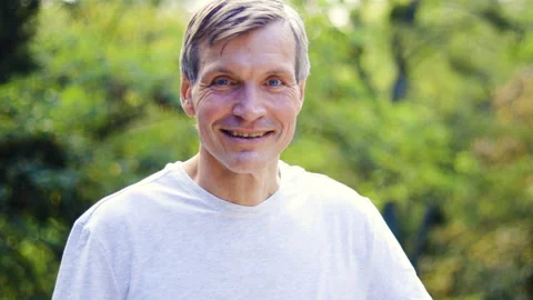 Mid-shot front view of diverse group of coworkers chatting and looking at Stock Footage 278043658