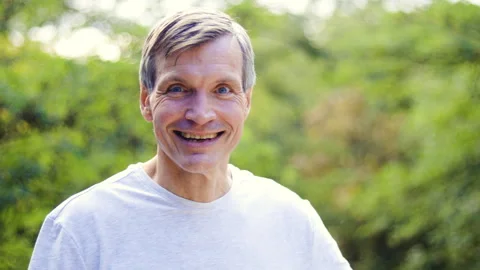 Mid-shot front view of diverse group of coworkers chatting and looking at Stock Footage 278043671