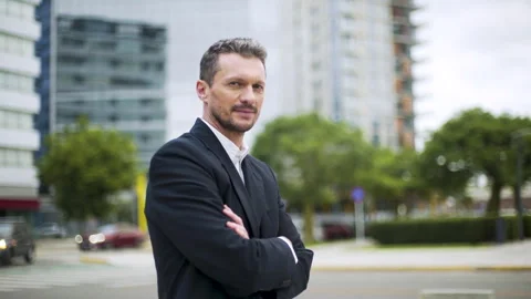Mid-shot front view of professional man posing with arms crossed while standing Stock Footage 277975335