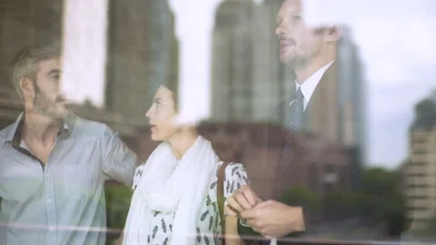 Mid-shot front view of real estate agent showing new apartment to potential Stock Footage 277973064