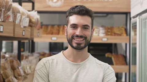 Mid-shot front view shot of young male small business owner looking at camera Vídeo Stock 277957934