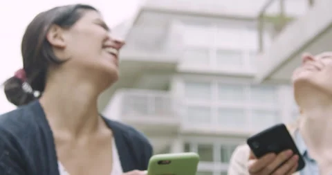 Mid-shot front view shot of two coworkers laughing and having a good time while Stock Footage 277965700