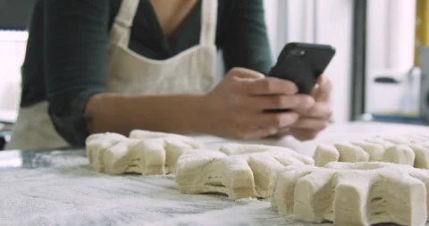 Mid-shot front view of unidentified person's hands using smart phone while Stock Footage 277958929