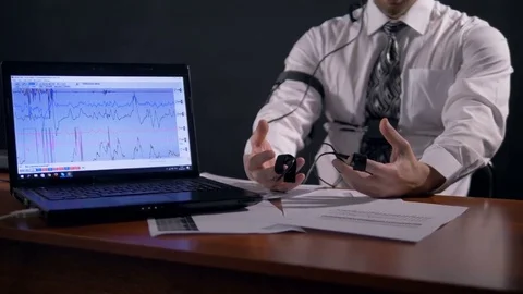Mid shot of the man connected to the lie detector. 4K. Stock Footage 77118291