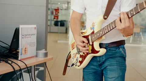 Mid shot man playing guitar 動画素材 66441607