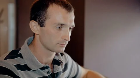 Mid shot Man working on computer and drink coffee in cafe Stock Footage 65716721