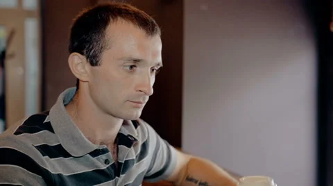 Mid shot Man working on computer and drink coffee in cafe Stock Footage 65716845