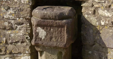 Mid shot of the plague stone on the Devils bridge at Kirkby Lonsdale, North Stock Footage 328864577