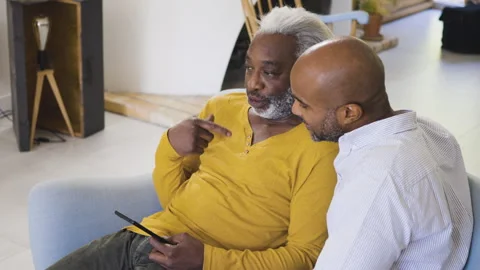 Mid-shot side view of diverse group of coworkers chatting in company hallway Stock Footage 278034519