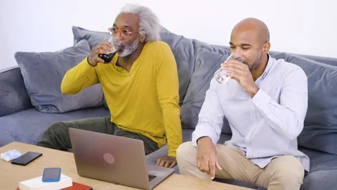 Mid-shot side view of diverse group of coworkers chatting in company hallway Stock Footage 278034701