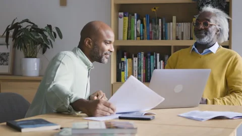 Mid-shot side view of diverse group of coworkers chatting in company hallway Stock Footage 278034799