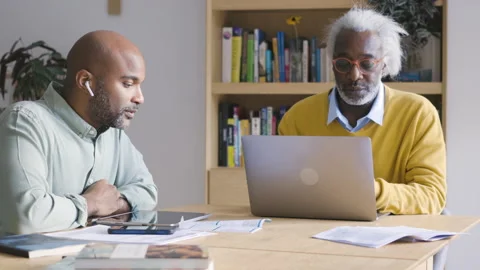 Mid-shot side view of diverse group of coworkers chatting in company hallway Stock Footage 278034972