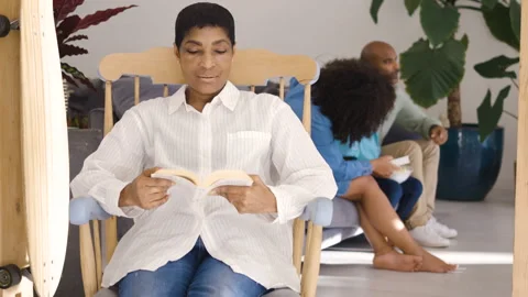 Mid-shot side view of diverse group of coworkers chatting in company hallway Video stock 278035302