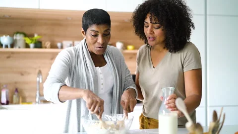 Mid-shot side view of diverse group of coworkers chatting in company hallway Stock Footage 278038100