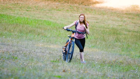 Mid-shot side view of relaxed group of coworkers going over details of marketing Stock Footage 278023590