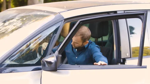 Mid-shot side view of relaxed group of coworkers going over details of marketing Stock Footage 278024679