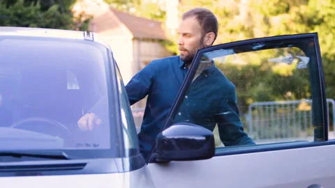 Mid-shot side view of relaxed group of coworkers going over details of marketing Stock Footage 278024702