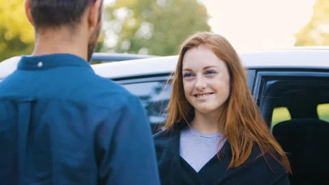 Mid-shot side view of relaxed group of coworkers going over details of marketing Stock Footage 278025125