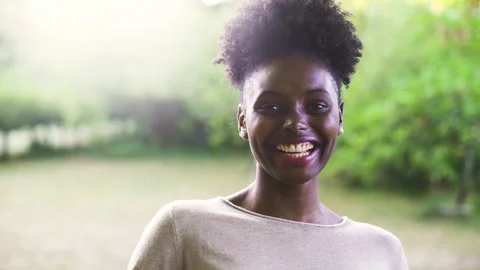 Mid-shot side view of relaxed group of coworkers going over details of marketing Stock Footage 278025515