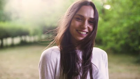 Mid-shot side view of relaxed group of coworkers going over details of marketing Stock Footage 278025741