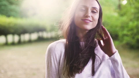 Mid-shot side view of relaxed group of coworkers going over details of marketing Stock Footage 278025753