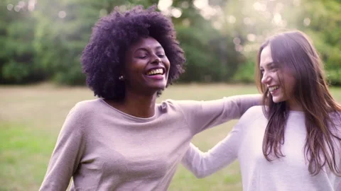 Mid-shot side view of relaxed group of coworkers going over details of marketing Stock Footage 278026294