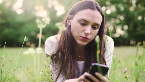 Mid-shot side view of relaxed group of coworkers going over details of marketing Stock Footage 278026329