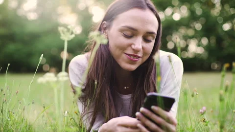 Mid-shot side view of relaxed group of coworkers going over details of marketing Stock Footage 278026411