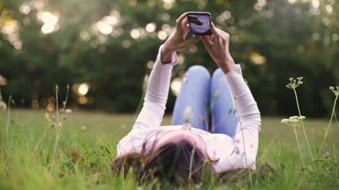 Mid-shot side view of relaxed group of coworkers going over details of marketing Stock Footage 278026493