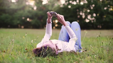 Mid-shot side view of relaxed group of coworkers going over details of marketing Stock Footage 278026499