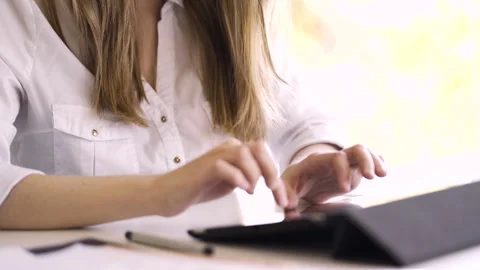 Mid-shot side view of unrecognizable woman's hands touching laptop's touchpad Stock Footage 277980041