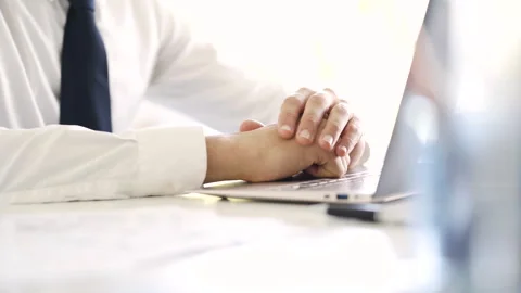 Mid-shot side view of unrecognizable woman's hands touching laptop's touchpad Stock Footage 277982543
