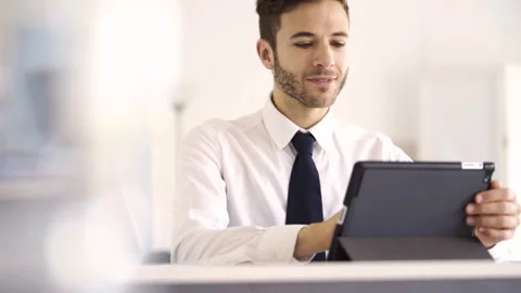 Mid-shot side view of unrecognizable woman's hands touching laptop's touchpad Video stock 277983207