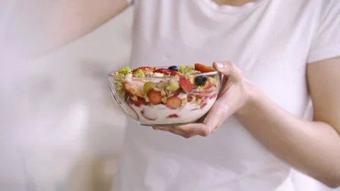 Mid-shot side view of unrecognizable woman's hands touching laptop's touchpad Stock Footage 277984172