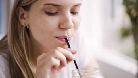 Mid-shot side view of unrecognizable woman's hands touching laptop's touchpad Video stock 277984584