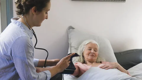 Mid-shot side view of unrecognizable person's hands holding cell phone and Stock Footage 278013320