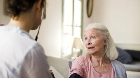 Mid-shot side view of unrecognizable person's hands holding cell phone and Stock Footage 278013570