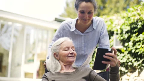 Mid-shot side view of unrecognizable person's hands holding cell phone and Stock Footage 278013872