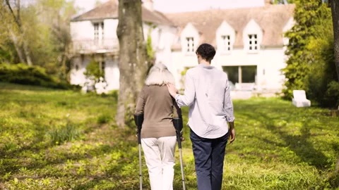 Mid-shot side view of unrecognizable person's hands holding cell phone and Stock Footage 278014059