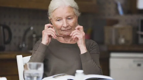 Mid-shot side view of unrecognizable person's hands holding cell phone and Stock Footage 278014229