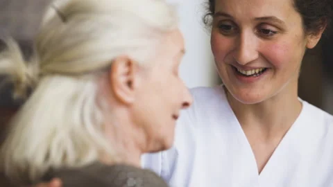 Mid-shot side view of unrecognizable person's hands holding cell phone and Stock Footage 278014346